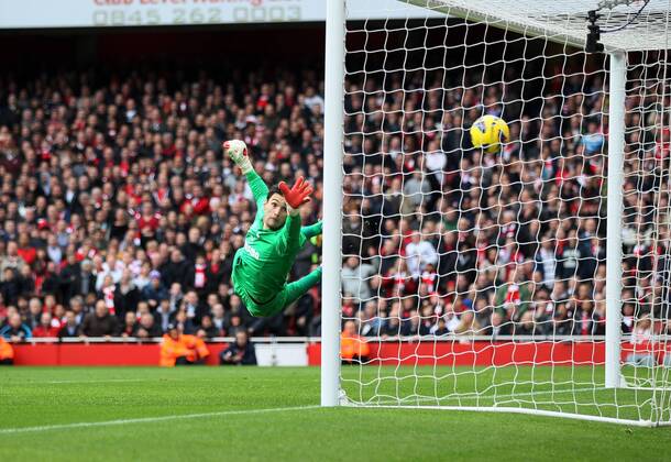 Arsenal s Per Mertesacker scoring his side opening goal past Tottenham s Hugo Lloris..Arsenal v Tottenham - Premier League- Emirates Stdaium, London- 17 11 12 - Picture David Klein Sportimage EDITORIAL USE ONLY. No use with unauthorised audio, video, data, fixture lists, club league logos or live services. Online in-match use limited to 120 images, no video emulation. No use in betting, games or single club league player publications.