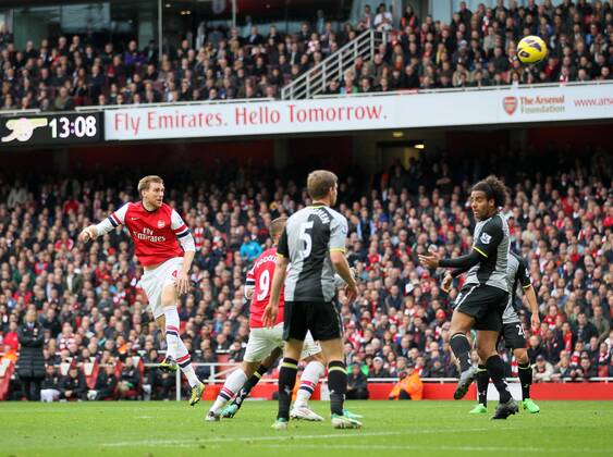 Arsenal s Per Mertesacker scoring his side opening goal..Arsenal v Tottenham - Premier League- Emirates Stdaium, London- 17 11 12 - Picture David Klein Sportimage EDITORIAL USE ONLY. No use with unauthorised audio, video, data, fixture lists, club league logos or live services. Online in-match use limited to 120 images, no video emulation. No use in betting, games or single club league player publications.