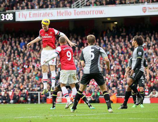 Arsenal s Per Mertesacker scoring his side opening goal..Arsenal v Tottenham - Premier League- Emirates Stdaium, London- 17 11 12 - Picture David Klein Sportimage EDITORIAL USE ONLY. No use with unauthorised audio, video, data, fixture lists, club league logos or live services. Online in-match use limited to 120 images, no video emulation. No use in betting, games or single club league player publications.