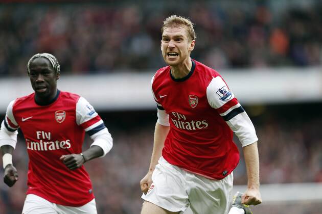 Arsenal s Per Mertesacker celebrates scoring his side opening goal..Arsenal FC London v Tottenham Hotspur - Premier League- Emirates Stadium, London- 17 11 12 - EDITORIAL USE ONLY. No use with unauthorised audio, video, data, fixture lists, club league logos or live services. Online in-match use limited to 120 images, no video emulation. No use in betting, games or single club league player publications.