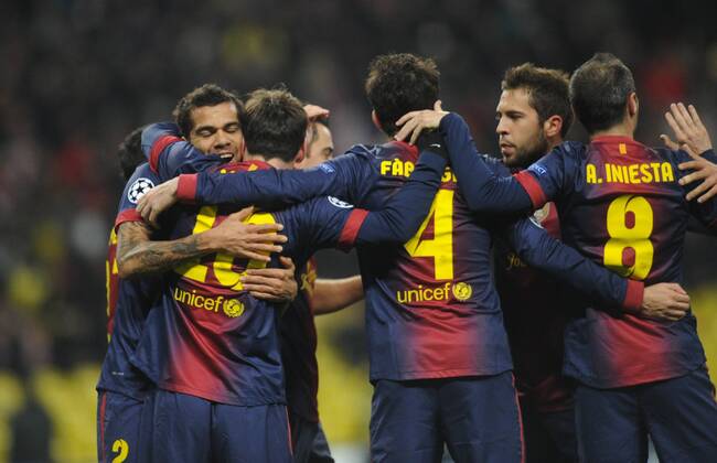 ITAR-TASS: MOSCOW, RUSSIA. NOVEMBER 20, 2012. Barcelona players celebrate a goal against Spartak in a UEFA Champions League Group G football match at Luzhniki Stadium.  RE10DE91