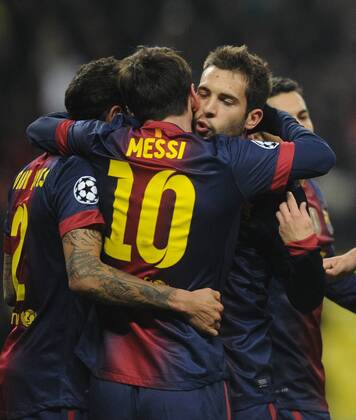 ITAR-TASS: MOSCOW, RUSSIA. NOVEMBER 20, 2012. Barcelona s Lionel Messi and his teammates celebrate a goal against Spartak in a UEFA Champions League Group G football match at Luzhniki Stadium.  RE10DE92