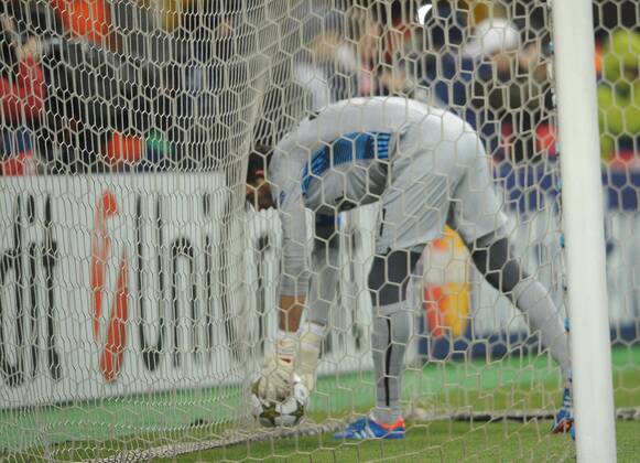 ITAR-TASS: MOSCOW, RUSSIA. NOVEMBER 20, 2012. Spartak s goalkeeper Andrei Dikan retrieves the ball from the net in a UEFA Champions League Group G football match against Barcelona at Luzhniki Stadium.  RE10DE9D