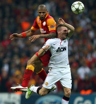 UEFA Champions league group H soccer match between Galatasaray v Manchester United at Turk Telekom Arena Stadium in Istanbul, Turkey on 20.11.2012 Pictured: Felipe Melo of Galatasaray and Tom Cleverley of Manchester United. 