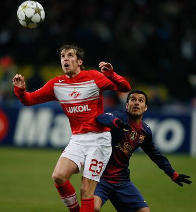 UEFA Champions League 2012 13 between FC Spartak (Moscow, Russia) and FC Barcelona (Barcelona, Barca). Dmitriy Kombarov (L) - Sergio Busquets