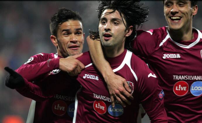 20.11.2012 Cluj-Napoca(Romania) FC CFR Cluj-SC Sporting Braga UEFA Champions League men football Rafael Bastos (L) with Rui Pedro(c) and Camora (r) FC CFR Cluj celebrate goal :Stringer in cooperation with 