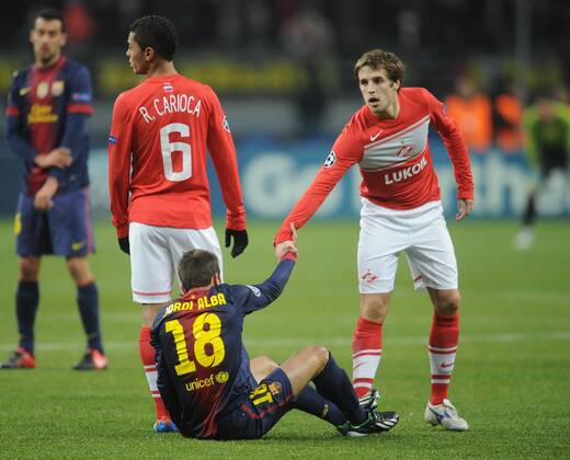 ITAR-TASS: MOSCOW, RUSSIA. NOVEMBER 20, 2012. Spartak s Rafael Carioca (L), Dmitry Kombarov (R) and Barcelona s Jordi Alba seen in their UEFA Champions Legaue Group G Round 5 football match at Luzhniki Stadium. FC Barcelona won the game 3:0.  premiumd RE10DEC3