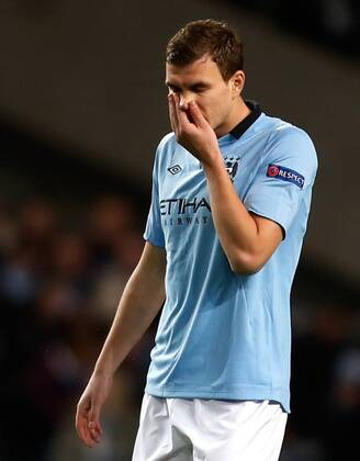 Edin Dzeko of Manchester City reacts during the match..Champions League football match between Manchester City and Real Madrid at the Etihad Stadium, Manchester on the 21st November 2012.. - EDITORIAL USE ONLY. No use with unauthorised audio, video, data, fixture lists, club league logos or live services. Online in-match use limited to 120 images, no video emulation. No use in betting, games or single club league player publications.
