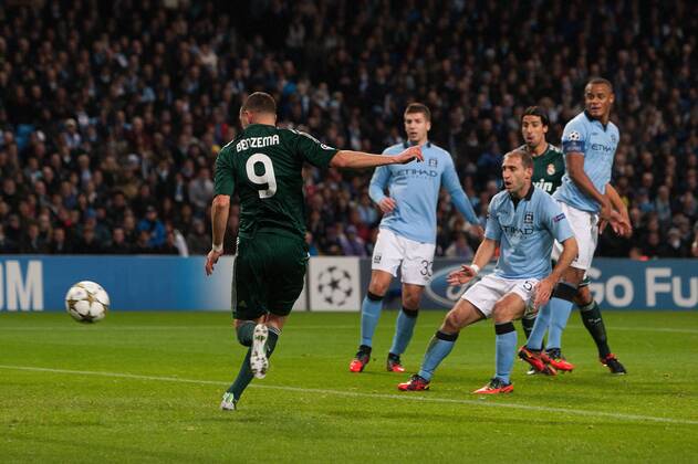 Football - 2012 2013 Champions League - Manchester City vs. Real Madrid Karim Benzema of Real Madrid scores the opening goal at the Etihad Stadium 