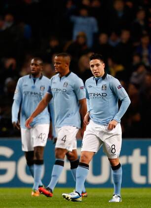 (L-R) Yaya Toure, Vincent Kompany and Samir Nasri of Manchester City after Real Madrid score their first goal..Champions League football match between Manchester City and Real Madrid at the Etihad Stadium, Manchester on the 21st November 2012.. - EDITORIAL USE ONLY. No use with unauthorised audio, video, data, fixture lists, club league logos or live services. Online in-match use limited to 120 images, no video emulation. No use in betting, games or single club league player publications.