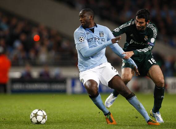 Football - 2012 2013 Champions League - Manchester City vs. Real Madrid Manchester City s Yaya Toure turns away from Real Madrid s Raul Albiol at the Etihad Stadium 