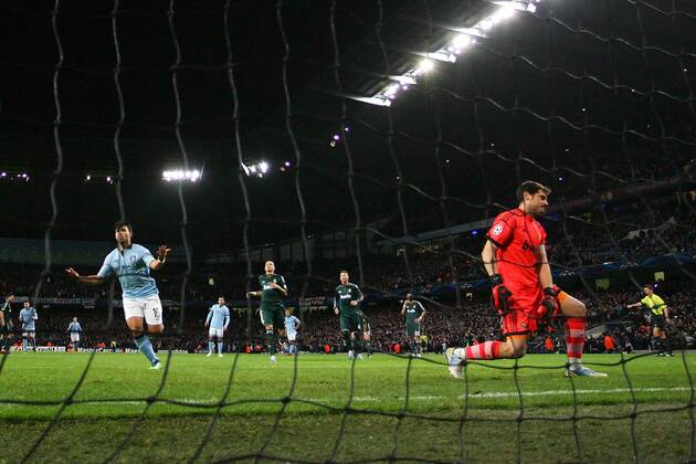 Football - 2012 2013 Champions League - Manchester City vs. Real Madrid Sergio Kun Aguero of Manchester City celebrates scoring his penalty kick at the Etihad Stadium 