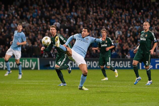 Football - 2012 2013 Champions League - Manchester City vs. Real Madrid Carlos Tevez of Manchester City cannot quite stretch far enough to connect with a cross at the Etihad Stadium 