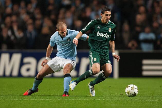 Football - 2012 2013 Champions League - Manchester City vs. Real Madrid Pablo Zabaleta of Manchester City and Angel di Maria of Real Madrid at the Etihad Stadium 