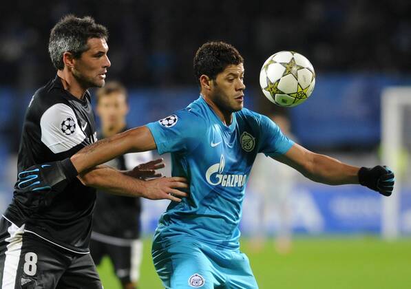 Malaga s Jeremy Toulalan (L) and Zenit s Hulk fight for the ball in their UEFA Champions League Group C Round 5 football match at Petrovsky Stadium. Zenit St. Petersburg vs CF Malaga  RE10E01A