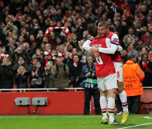 Arsenal s Lukas Podolski celebrates scoring his sides second goal. FC Arsenal London v HSC Montpellier -Champions League- Emirates Stadium,, London- 21 11 12 - Picture DavidxKlein Sportimage EDITORIAL USE ONLY. No use with unauthorised audio, video, data, fixture lists, club league logos or live services. Online in-match use limited to 120 images, no video emulation. No use in betting, games or single club league player publications.