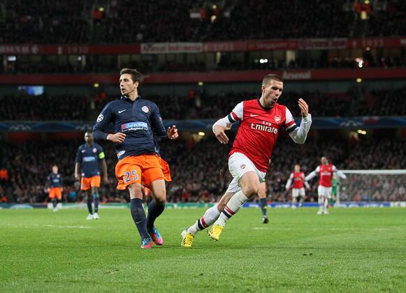 Arsenal s Lukas Podolski celebrates scoring his sides second goal. FC Arsenal London v HSC Montpellier -Champions League- Emirates Stadium, London- 21 11 12 - Picture DavidxKlein Sportimage EDITORIAL USE ONLY. No use with unauthorised audio, video, data, fixture lists, club league logos or live services. Online in-match use limited to 120 images, no video emulation. No use in betting, games or single club league player publications.