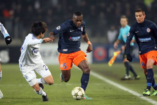 Henri Bedimo gegen Atsuto Uchida MONTPELLIER FACE A Schalke 04 FOOTBALL : Montpellier vs Schalke 04 - Ligue des Champions - 04 12 2012 RichardGosselin Panoramic 