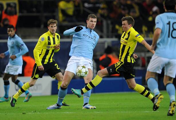 04-12-2012, Fussball, Saison 2012-2013, UEFA Champions League, Gruppenphase, Borussia Dortmund - Manchester City, v.re., Kevin Großkreutz (Borussia Dortmund), Edin Dzeko (Manchester City) und Oliver Kirch (Borussia Dortmund)