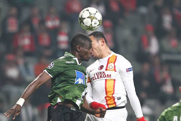 Elderson Uwa Echiejile (L) of SC Braga (Sporting) heads with Umut Bulut of Galatasaray during the UEFA Champions League, Group H match at AXa Stadium in Braga.and
