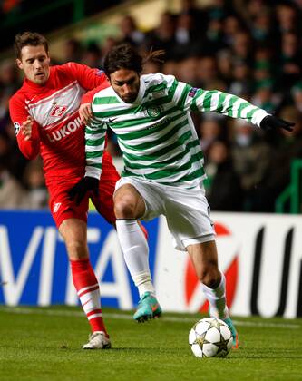 Georgios Samaras (R) of Celtic in action with Kirill Kombarov of Spartak Moscow - UEFA Champions League group G - Celtic vs Spartak Moscow - Celtic Park - Glasgow - Scotland - 5th September 2012 EDITORIAL USE ONLY. No use with unauthorised audio, video, data, fixture lists, club league logos or live services. Online in-match use limited to 120 images, no video emulation. No use in betting, games or single club league player publications.