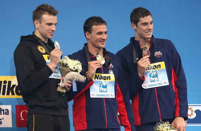 SCHWIMMEN - FINA Kurzbahn WM Istanbul ISTANBUL,TUERKEI,12.DEZ.12 - DIVERS, SCHWIMMEN - FINA Kurzbahn Weltmeisterschaft, 200m Freistil der Herren, Siegerehrung. Bild zeigt Paul Biedermann (GER), Ryan Lochte und Conor Dwyer (USA). Keyword: Medaillen. 