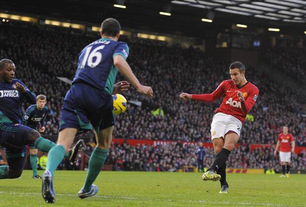Robin van Persie of Manchester United scores the first - On the left: John Oshea - Barclays Premier League - Manchester United vs AFC Sunderland - Old Trafford Stadium - Manchester - 15 12 12 EDITORIAL USE ONLY. No use with unauthorised audio, video, data, fixture lists, club league logos or live services. Online in-match use limited to 120 images, no video emulation. No use in betting, games or single club league player publications.