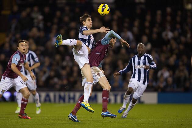 Football - 2012 2013 Premier League - West Bromwich Albion vs. West Ham United West Brom s Zoltan Gera climbs over West Ham s Joey O Brien at The Hawthorns
