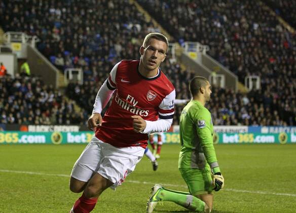 Arsenal s Lukas Podolski celebrates scoring his sides opening goal Reading v Arsenal - Premier League - Madejski Stadium, Reading- 17 12 12 - Picture David Klein Sportimage EDITORIAL USE ONLY. No use with unauthorised audio, video, data, fixture lists, club league logos or live services. Online in-match use limited to 120 images, no video emulation. No use in betting, games or single club league player publications.