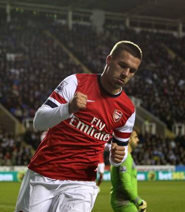 Arsenal s Lukas Podolski celebrates scoring his sides opening goal Reading v Arsenal - Premier League - Madejski Stadium, Reading- 17 12 12 - Picture David Klein Sportimage EDITORIAL USE ONLY. No use with unauthorised audio, video, data, fixture lists, club league logos or live services. Online in-match use limited to 120 images, no video emulation. No use in betting, games or single club league player publications.