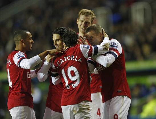 Arsenal s Lukas Podolski celebrates scoring his sides opening goal Reading v Arsenal - Premier League - Madejski Stadium, Reading- 17 12 12 - Picture David Klein Sportimage EDITORIAL USE ONLY. No use with unauthorised audio, video, data, fixture lists, club league logos or live services. Online in-match use limited to 120 images, no video emulation. No use in betting, games or single club league player publications.
