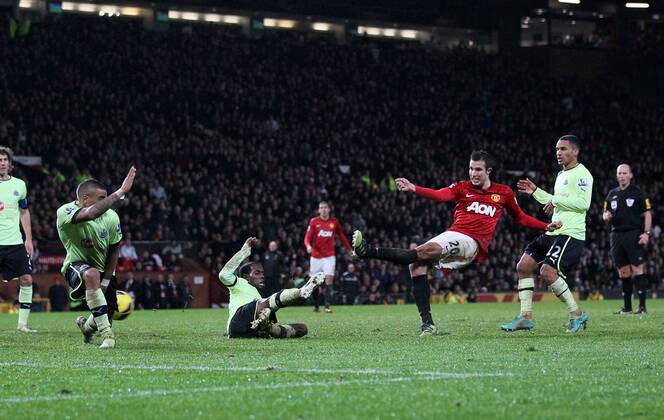 Manchester United s Robin Van Persie scoring his sides third goal..- Manchester United v Newcastle United - Barclays Premier League - Old Trafford, Manchester- 26 12 12 - Picture David Klein Sportimage EDITORIAL USE ONLY. No use with unauthorised audio, video, data, fixture lists, club league logos or live services. Online in-match use limited to 120 images, no video emulation. No use in betting, games or single club league player publications.