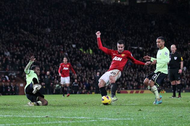 Manchester United s Robin Van Persie scoring his sides third goal..- Manchester United v Newcastle United - Barclays Premier League - Old Trafford, Manchester- 26 12 12 - Picture David Klein Sportimage EDITORIAL USE ONLY. No use with unauthorised audio, video, data, fixture lists, club league logos or live services. Online in-match use limited to 120 images, no video emulation. No use in betting, games or single club league player publications.