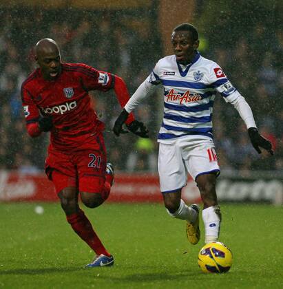 Football - 2012 2013 Premier League - Queens Park Rangers (QPR) vs West Bromwich Albion Shaun Wright-Phillips of Queens Park Rangers (QPR) out paces Youssouf Mulumbu of West Bromwich Albion at Loftus Road Stadium