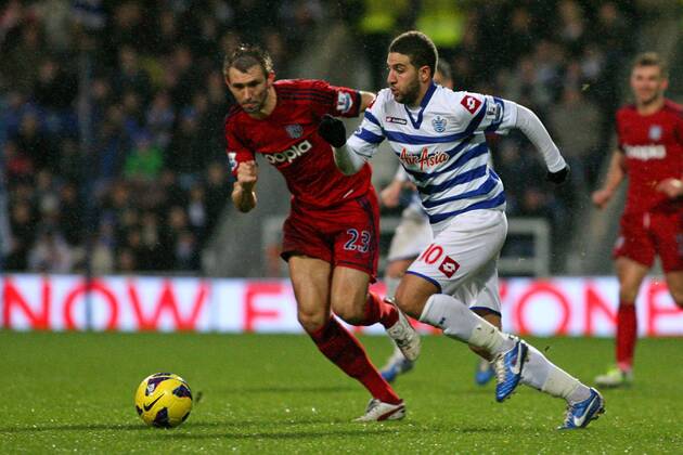 Football - 2012 2013 Premier League - Queens Park Rangers (QPR) vs West Bromwich Albion Adel Taarabt of Queens Park Rangers (QPR) and Gareth McAuley of West Bromwich Albion in action