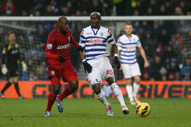 Football - 2012 2013 Premier League - Queens Park Rangers (QPR) vs West Bromwich Albion Stephane Mbia of Queens Park Rangers (QPR) and Youssouf Mulumbu of West Bromwich Albion in action at Loftus Road Stadium