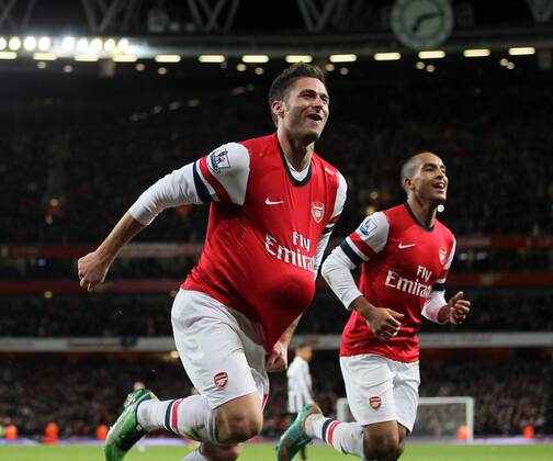 Arsenal s Olivier Giroud celebrates scoring his sides fifth goal with Theo Walcott..- Arsenal v Newcastle United - Barclays Premier League - the Emirates Stadium, London- 29 12 12 - Picture David Klein Sportimage EDITORIAL USE ONLY. No use with unauthorised audio, video, data, fixture lists, club league logos or live services. Online in-match use limited to 120 images, no video emulation. No use in betting, games or single club league player publications.