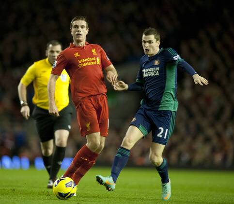 Jordan Henderson of Liverpool tussles with Adam Johnson of Sunderland - Barclays Premier League - Liverpool vs Sunderland - Anfield Stadium - Liverpool - 02 01 13 - Picture Simon Bellis Sportimage EDITORIAL USE ONLY. No use with unauthorised audio, video, data, fixture lists, club league logos or live services. Online in-match use limited to 120 images, no video emulation. No use in betting, games or single club league player publications.