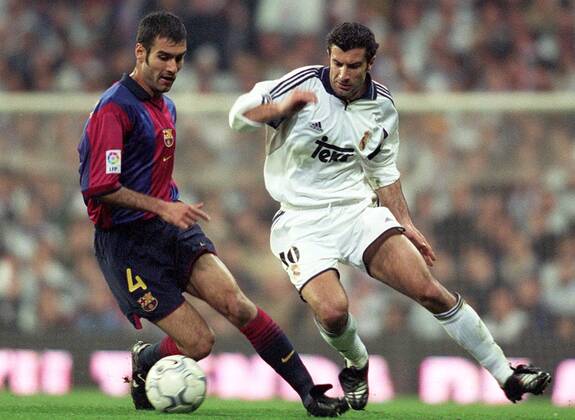 Pep GUARDIOLA, Football player from Spain, Barcelona (Barca) s midfielder, protects ball close to Figo, Real Madrid s midfielder. Real Madrid - Barcelona (Barca) League 2000-01. Santiago Bernabeu Stadium, Madrid. 03-03-2001. 