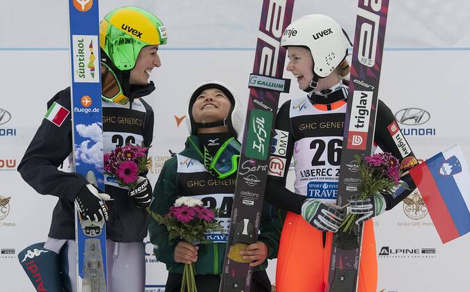 Japan s Sara Takanashi, center, greets the audience after she won the women s ski jump race during Nordic Junior World Ski Championships in Liberec, some 90 kilometers north of Prague, Czech Rep., on Thursday, Jan. 24, 2013. Second Evelyn Insam of Italy is seen on the left and third Katja Pozun of Slovenia on the right. (CTKxPhoto RadekxPetrasek) CTKPhotoP201301240610501  PET
