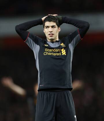 Liverpool s Luis Suarez looks on dejected after a missed chance.. - FC Arsenal vs FC Liverpool - Barclays Premier League - Emirates Stadium, London- 30 01 13 - EDITORIAL USE ONLY. No use with unauthorised audio, video, data, fixture lists, club league logos or live services. Online in-match use limited to 120 images, no video emulation. No use in betting, games or single club league player publications.