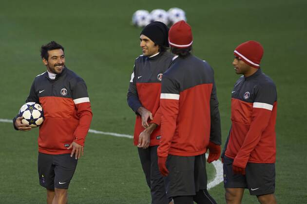 VALENCIA, SPAIN- FEBRUARY 11: Ezequiel Lavezzi of Paris Saint-Germain FC talks at the training season ahead of their UEFA Champions League round of 16 match of Paris Saint Germain at the Mestalla stadium on February 11, 2013 in Valencia, Spain. . 
