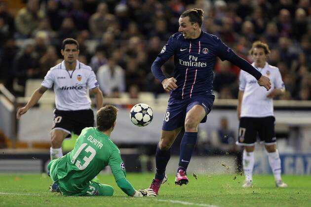 Football - 2012 2013 Champions League - Round of 16, First Leg: Valencia CF vs. Paris Saint-Germain (PSG) Zlatan Ibrahimovic of PSG has a shot blocked by Valencia s Vincente Guaita at Mestalla Stadium 