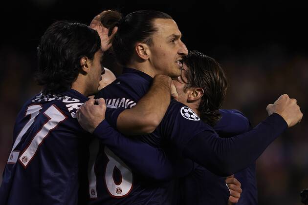 VALENCIA, SPAIN- FEBRUARY 12: Ezequiel Lavezzi of Paris Saint-Germain FC celebrates after scoring with Zlatan Ibrahimovic of Paris Saint-Germain FC and Maxwell of Paris Saint-Germain FC during UEFA Champions League round of 16 first leg match between Valencia CF and Paris Saint Germain (PSG) at the Mestalla stadium in Valencia, Spain. . 