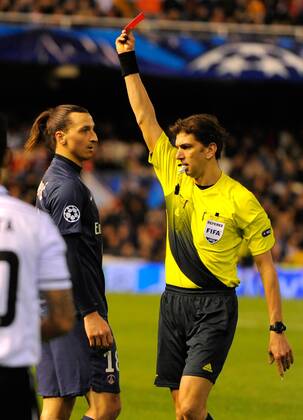 Zlatan Ibrahimovic of Paris Saint Germain receives a red card by referee Paolo Tagliavento in the last minute of the game - UEFA Champions League First Knockout Round 1st leg - FC Valencia vs PSG Paris St Germain - Mestalla Stadium - Valencia - - EDITORIAL USE ONLY. No use with unauthorised audio, video, data, fixture lists, club league logos or live services. Online in-match use limited to 120 images, no video emulation. No use in betting, games or single club league player publications.