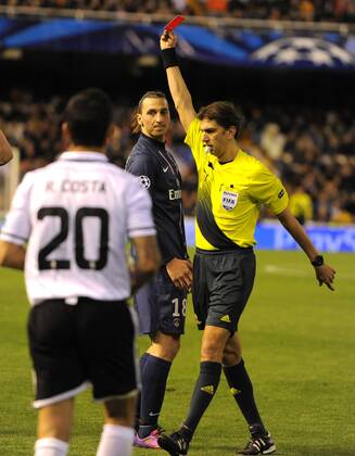 Zlatan Ibrahimovic of Paris Saint Germain receives a red card by referee Paolo Tagliavento in the last minute of the game - UEFA Champions League First Knockout Round 1st leg - FC Valencia vs PSG Paris St Germain - Mestalla Stadium - Valencia - - EDITORIAL USE ONLY. No use with unauthorised audio, video, data, fixture lists, club league logos or live services. Online in-match use limited to 120 images, no video emulation. No use in betting, games or single club league player publications.