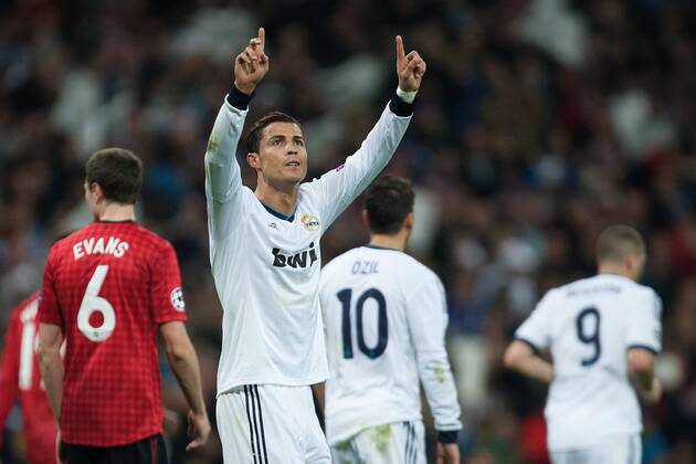 Football - 2012 2013 Champions League - Round of 16, First Leg: Real Madrid vs. Manchester United Cristiano Ronaldo of Real Madrid celebrates scoring to level it at 1-1 at the Santiago Bernabeu 