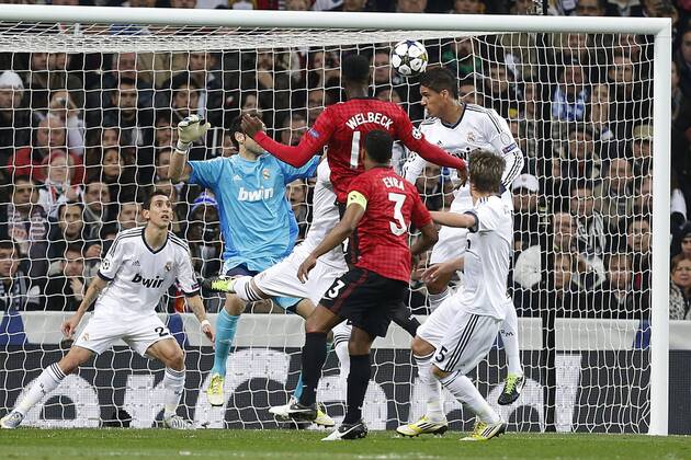 Real Madrid s Angel Di Maria, Diego Lopez, Cristiano Ronaldo and Fabio Coentrao and Manchester United s Danny Welbeck and Patrice Evra during Champions League 2012 2013 match.February 12,2013.  (20228)