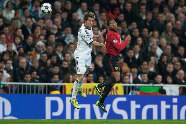 Football - 2012 2013 Champions League - Round of 16, First Leg: Real Madrid vs. Manchester United Fabio Coentrao of Real Madrid and Antonio Valencia of Manchester United at the Santiago Bernabeu 
