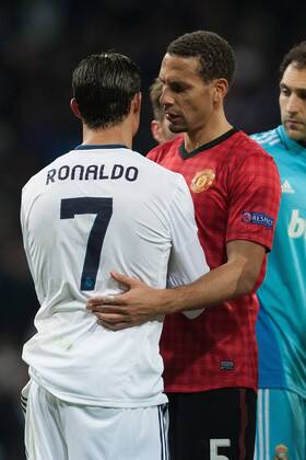 Football - 2012 2013 Champions League - Round of 16, First Leg: Real Madrid vs. Manchester United Rio Ferdinand of Manchester United with Cristiano Ronaldo of Real Madrid at the Santiago Bernabeu 